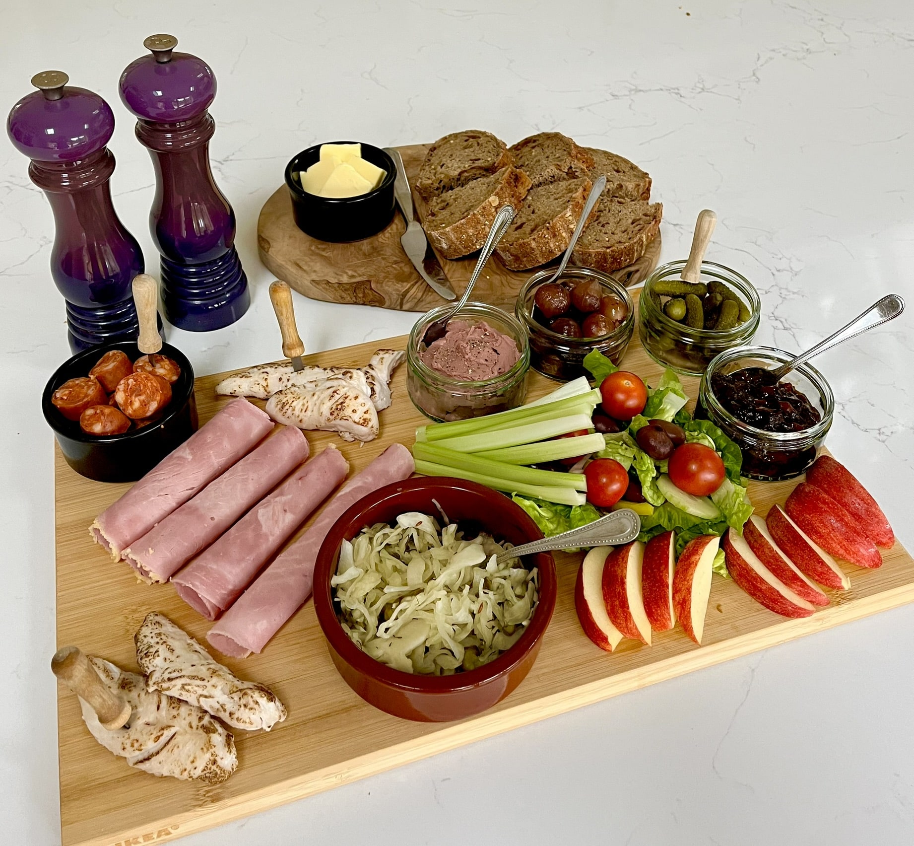 Dinner Containing assortment of Meats, Fruits & Condiments