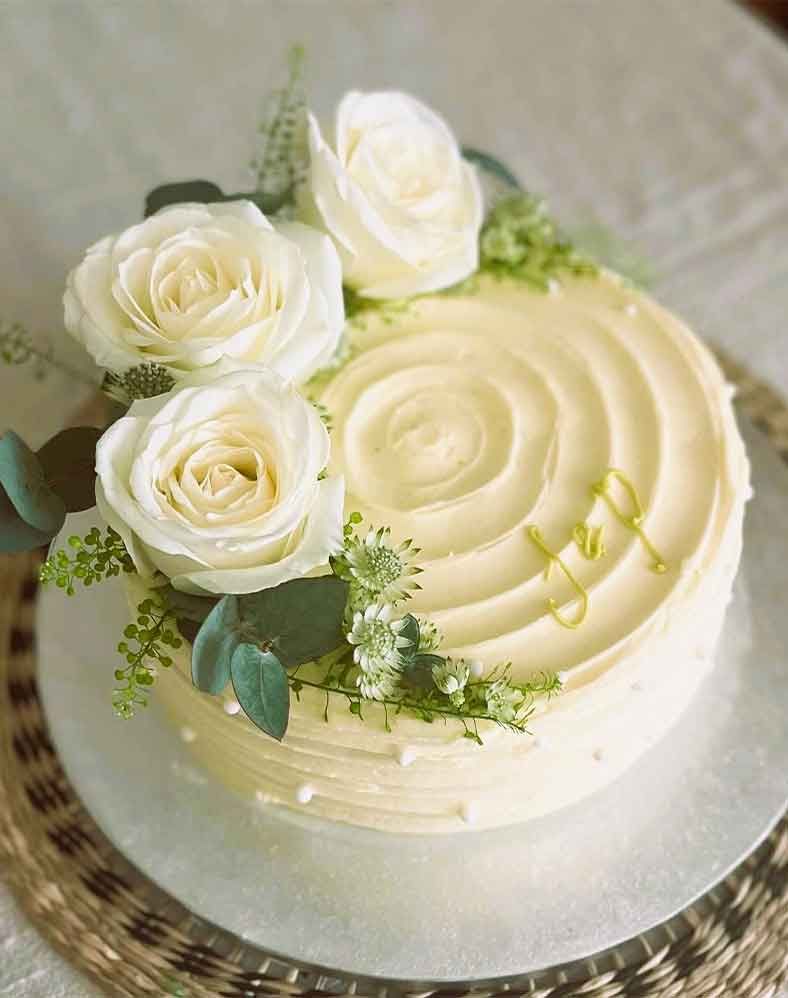 White Cake with Flowers on top.