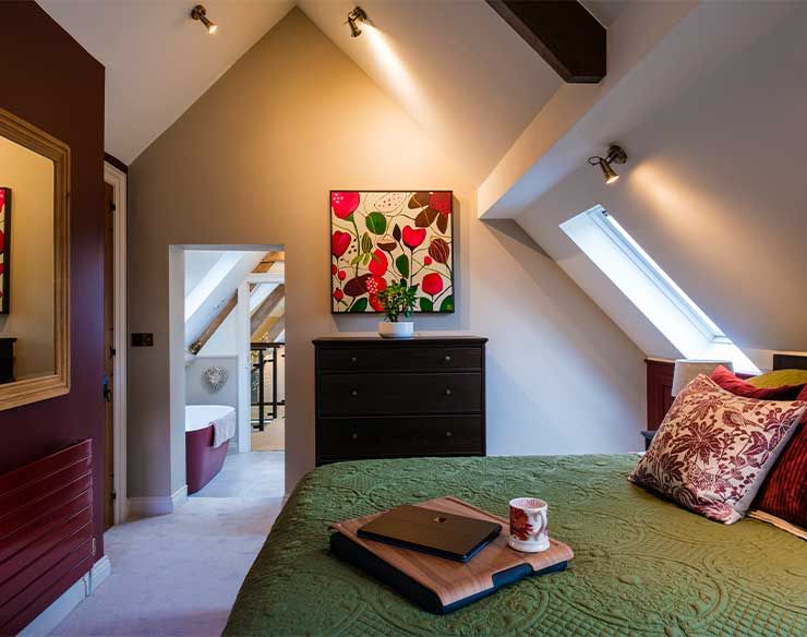 Orchard Room Side view of Green Bed, with Door in Background.